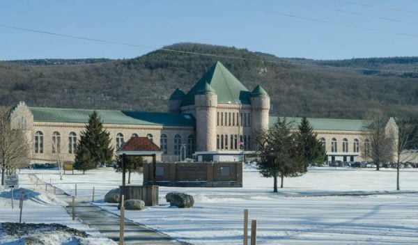Exterior view of the Eastern New York Correctional Facility covered in snow.