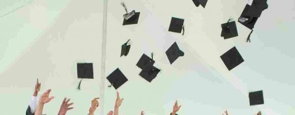 Illustration of hands tossing graduation caps into the sky.