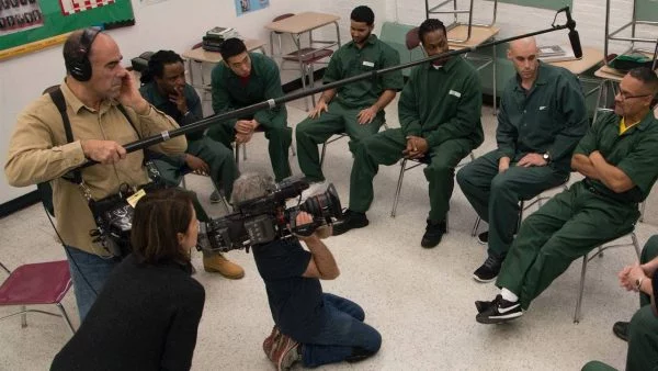 BPI students being interviewed in prison by documentary crew.