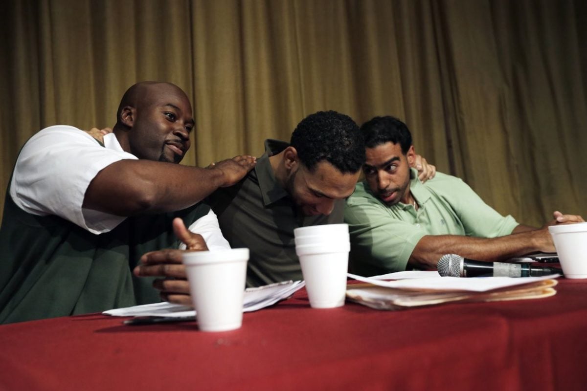 Prison inmates and members of the Bard Prison Initiative debate team, from left: Carl Snyder, Dyjuan Tatro and Carlos Polanco embraced after winning a debate against Harvard at the Eastern New York Correctional facility in 2015. PHOTO: PETER FOLEY FOR THE WALL STREET JOURNAL