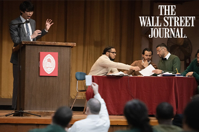 Image of a debate at Eastern with The Wall Street Journal logo