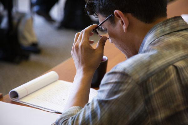 Man looking at form.