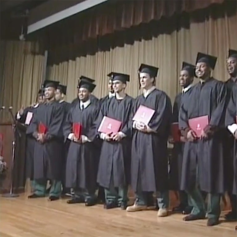 BPI students standing with diplomas in 60 Minutes segment.