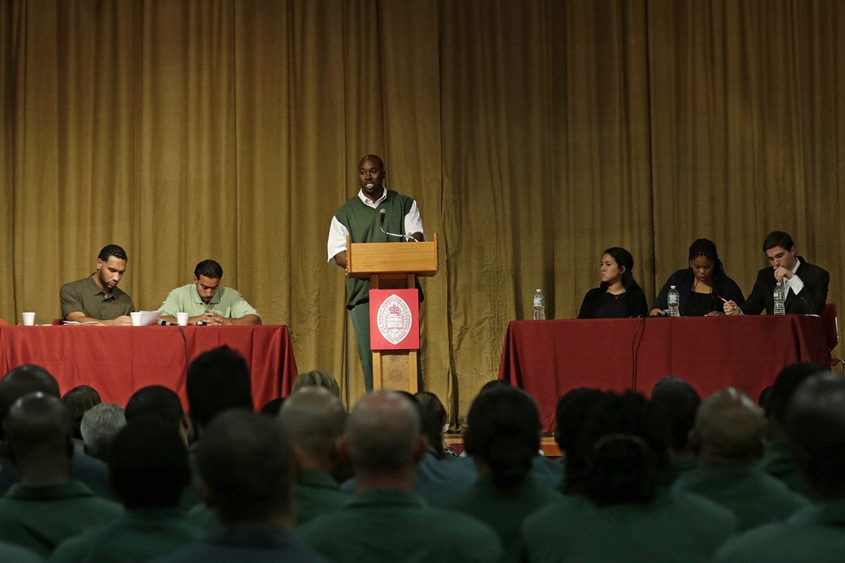 BPI students debate on stage with Harvard