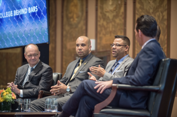 Panelists sitting on stage 