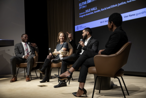 Panelists sitting on stage 