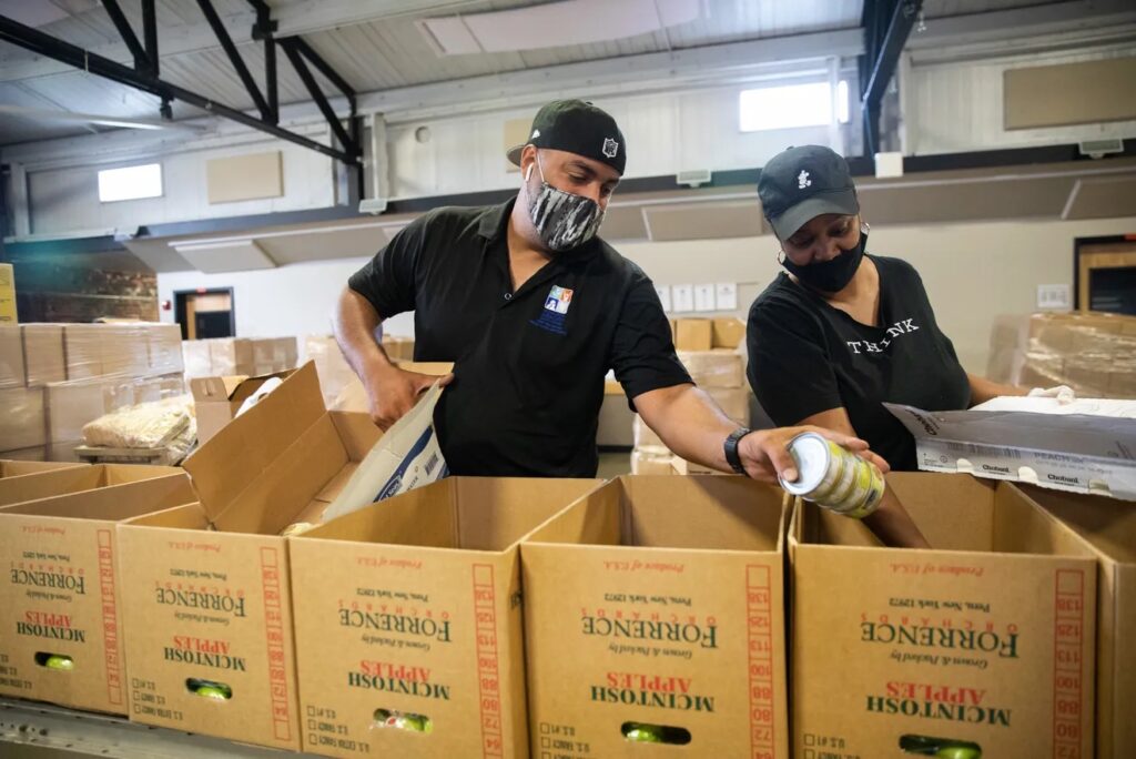 Men working with boxes of food