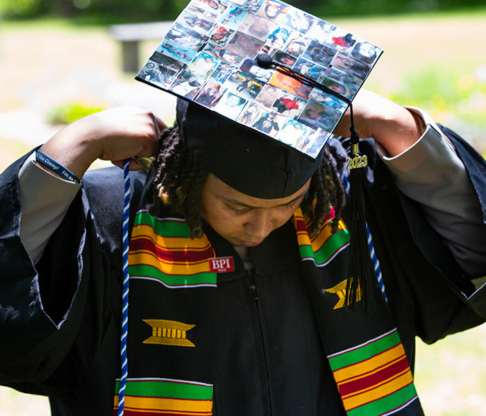 Bard graduate in colorful graduation gear.