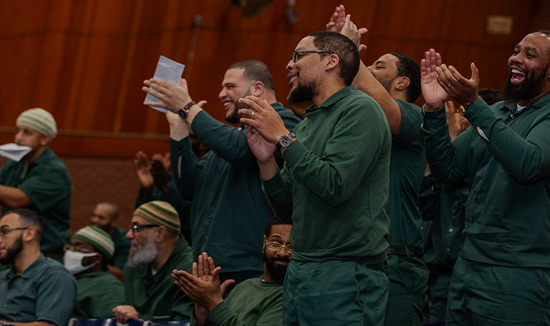 Students applaud at a debate.