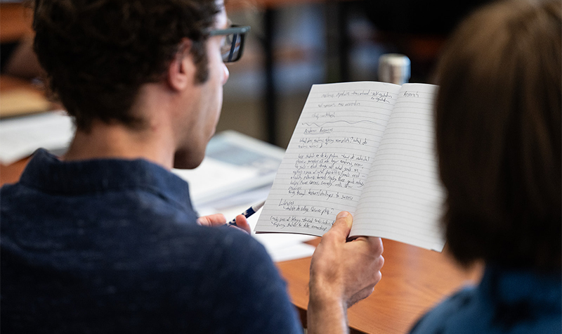 A man taking notes at BPI Summer Residency.