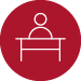 Student at Desk Icon