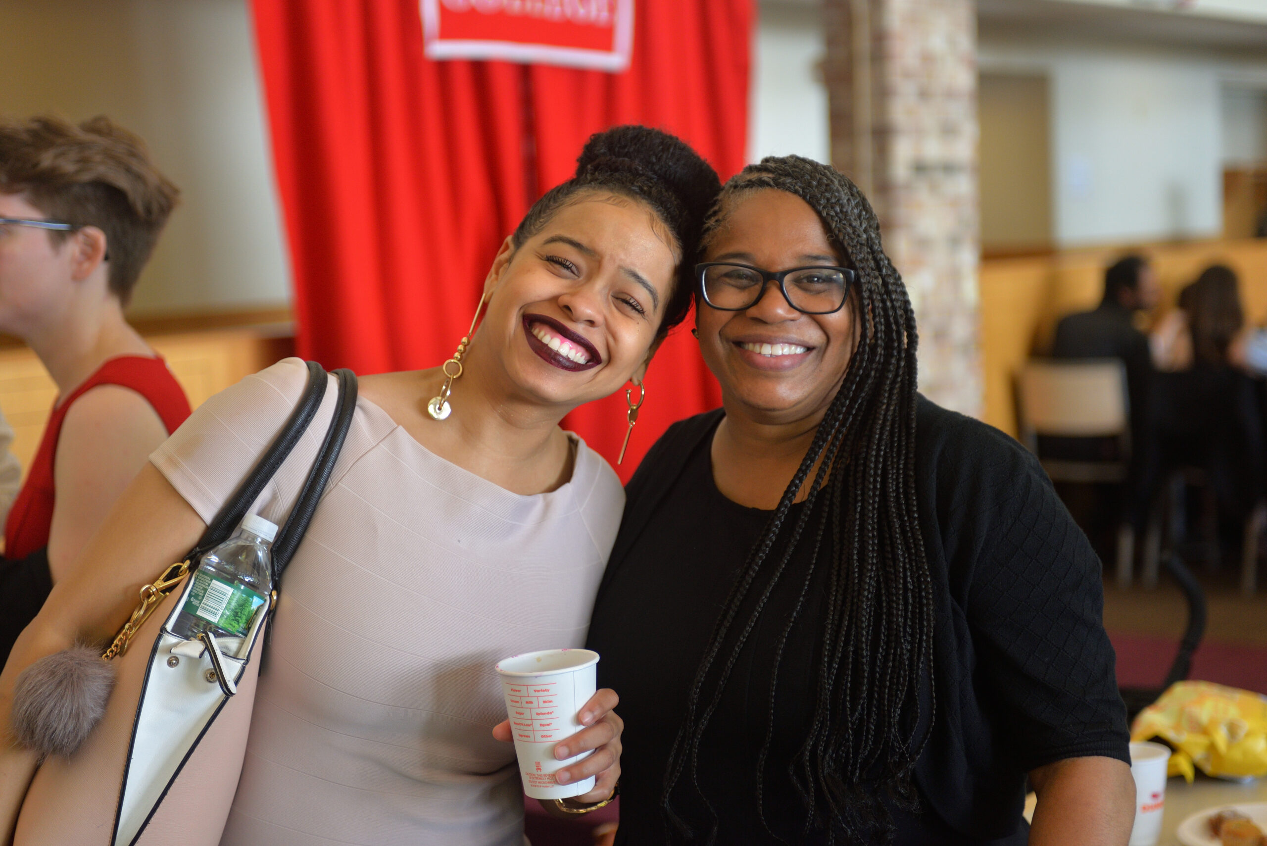 Alumnae smiling for the camera.